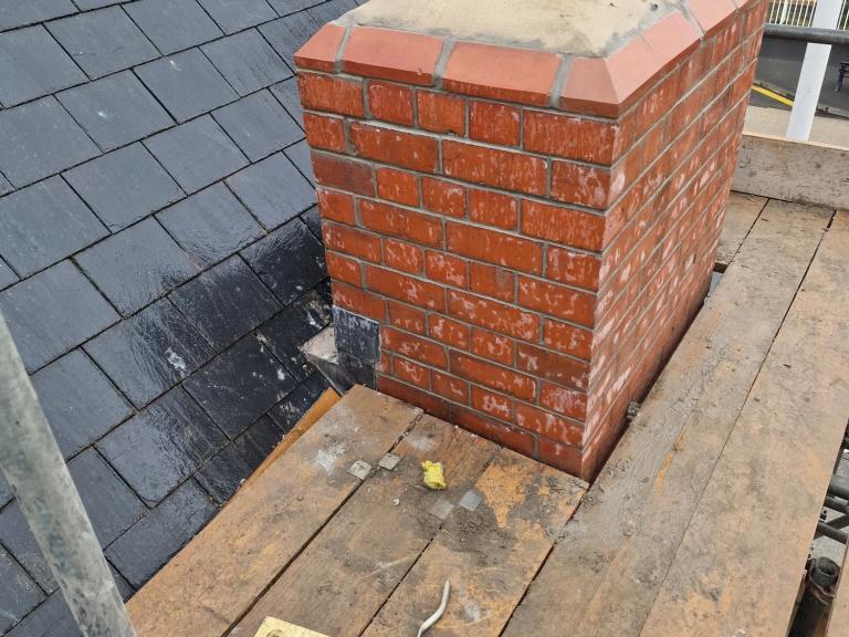 Despite the wet Welsh weather, we were able to reach the chimneys to grind out the pointing