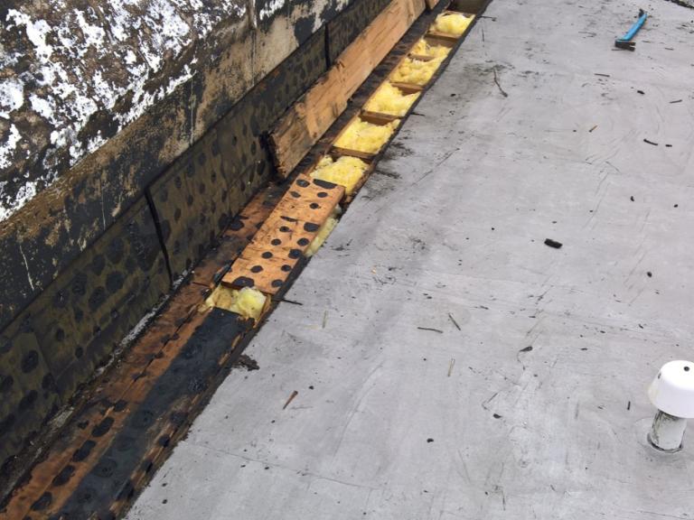 Interjoist areas were filled to prevent through draft to new warm roof