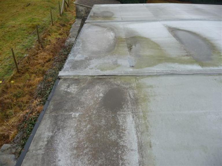 Before - The PVC roof coating had reached the end of its life