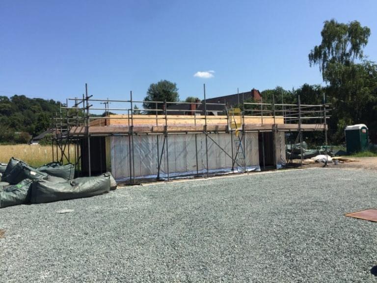 The detached building with roofing in progress