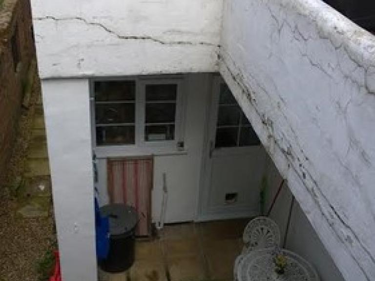 with water dripping onto the seating terrace below