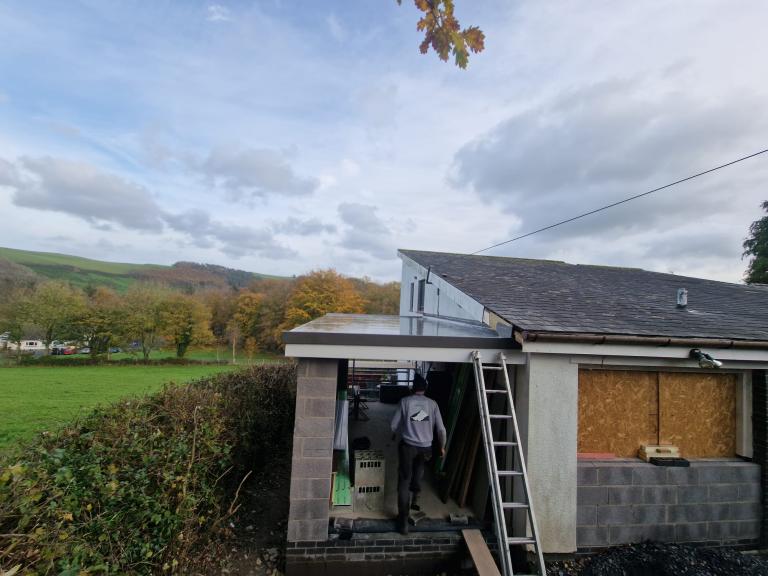 The roof is designed with a tilt to aid drainage