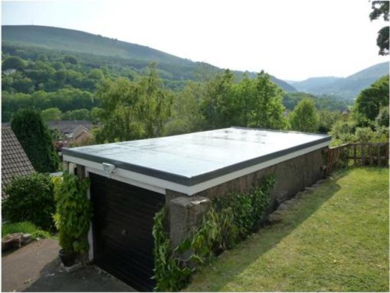 The same roof after a full 15 year jointless and seamless reinforced liquid membrane system was applied